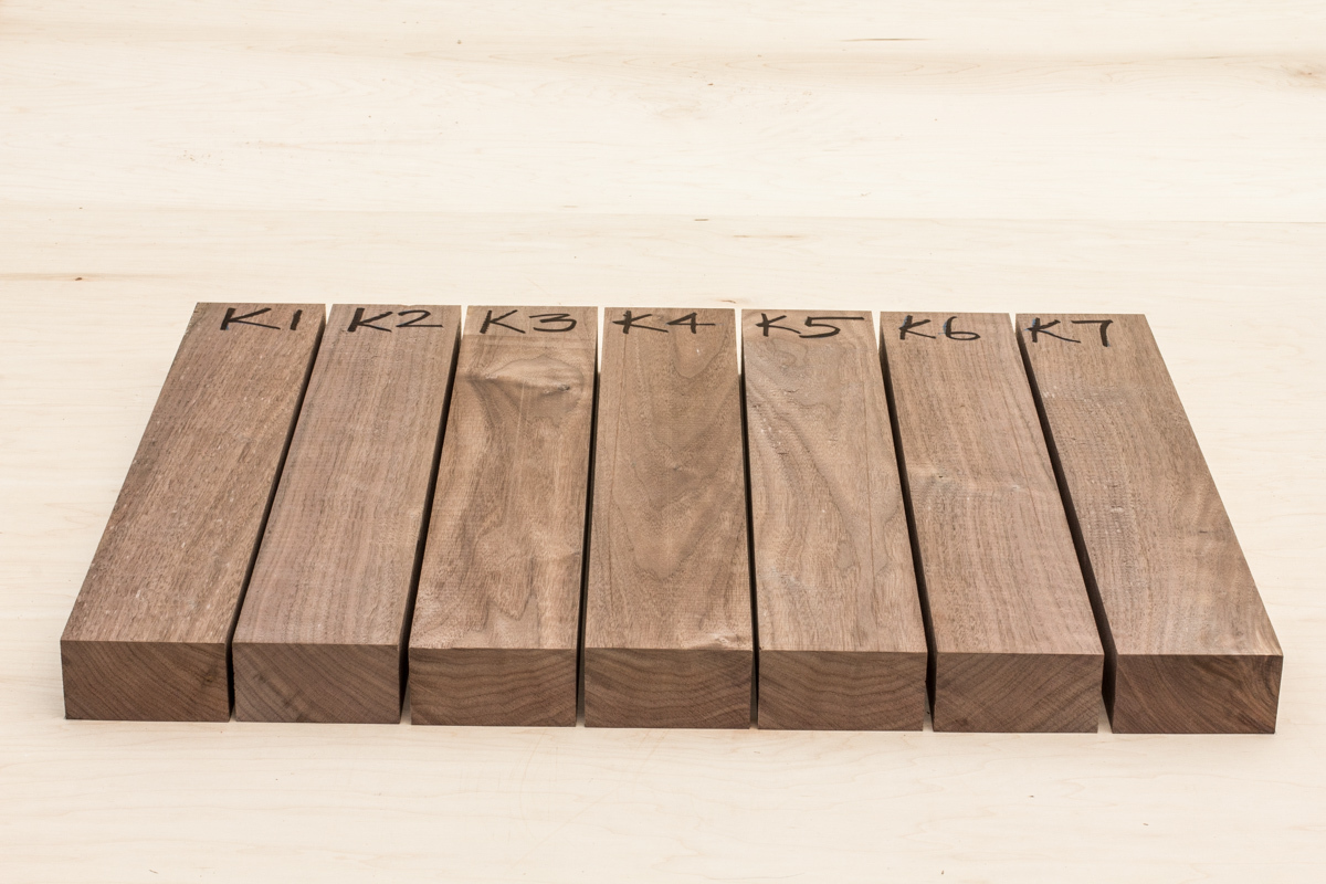 seven boards that will make a rocking chair seat, organized and numbered for production.