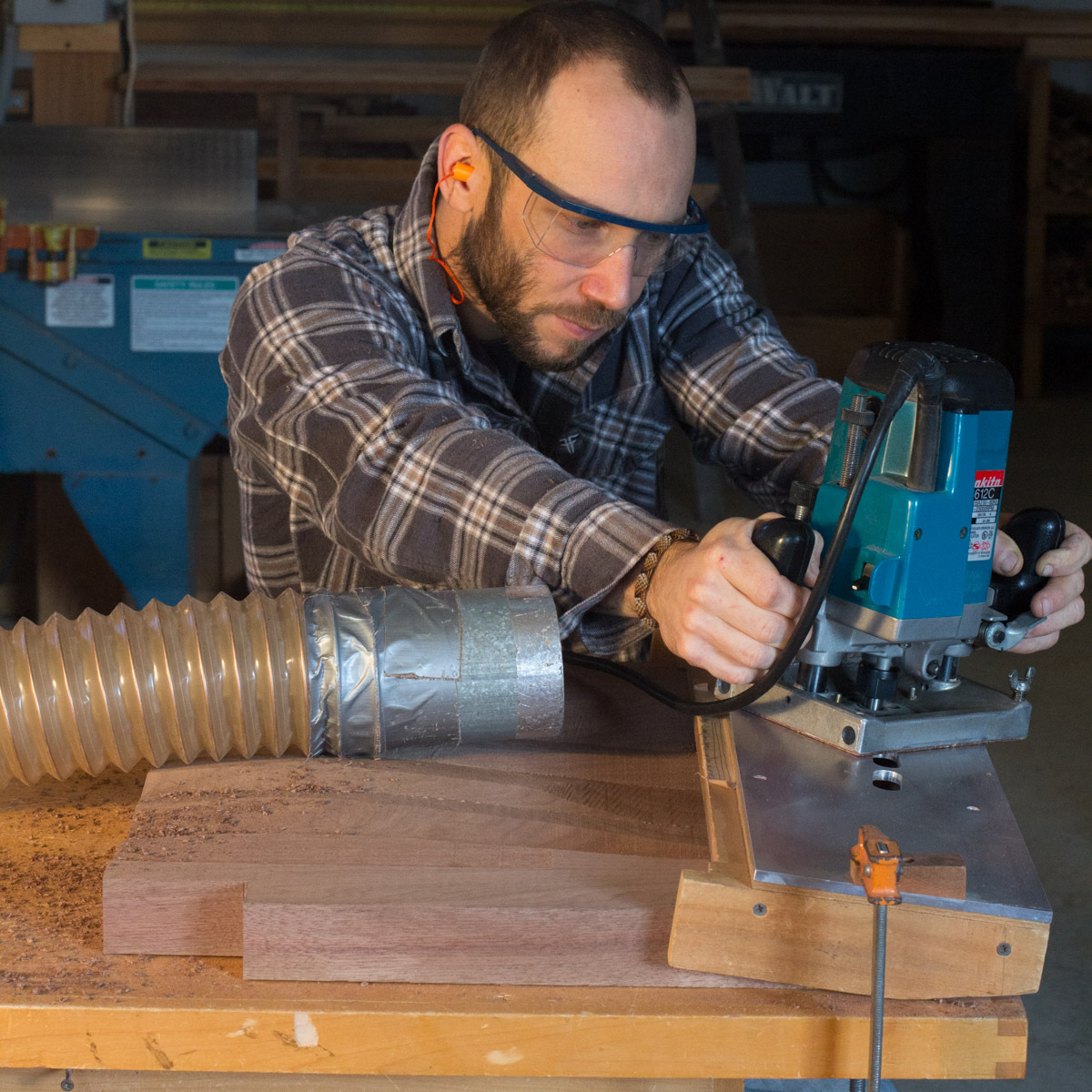 Aaron mortising walnut seats with plunge router and fixture