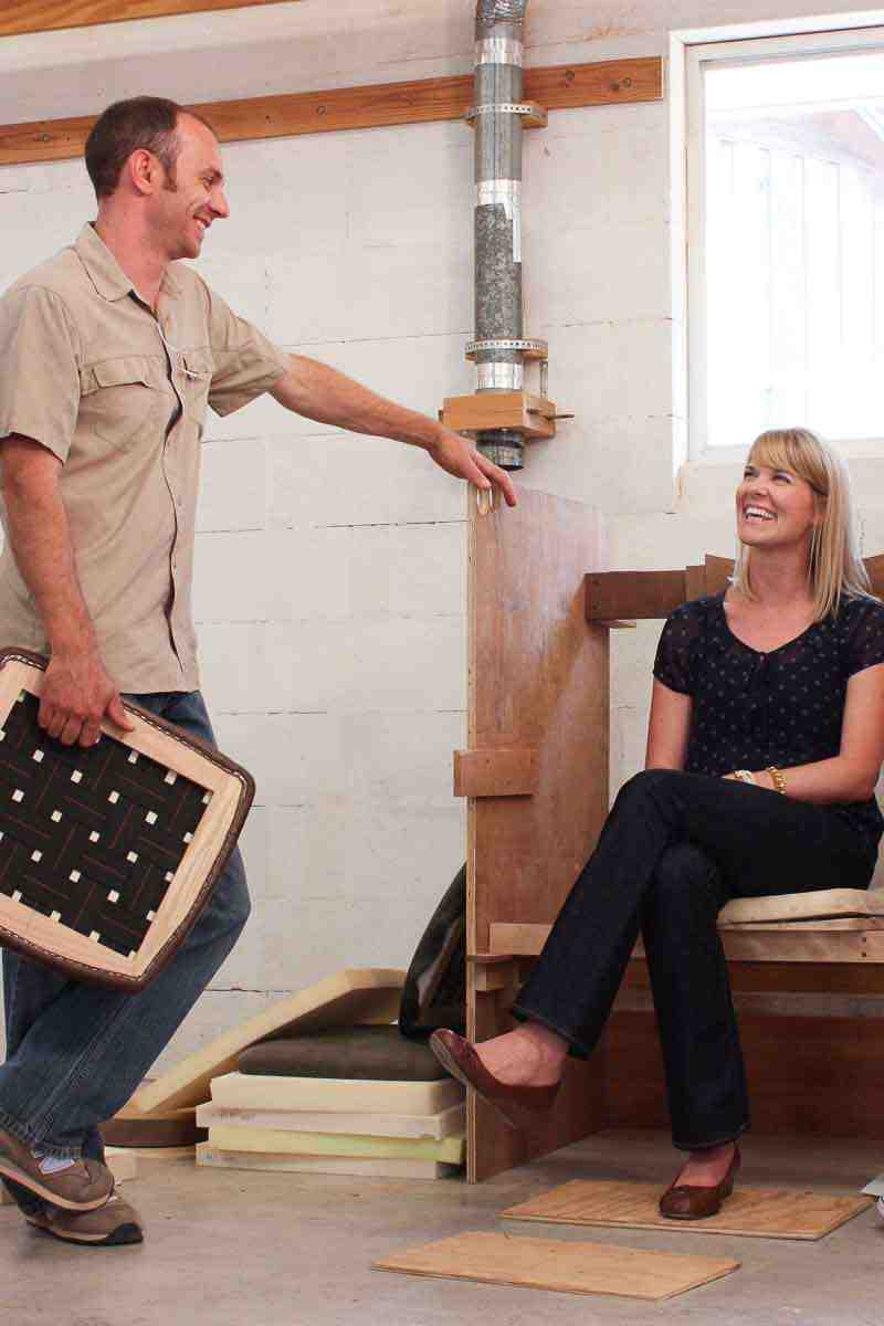 Austin with visitor at fitting booth