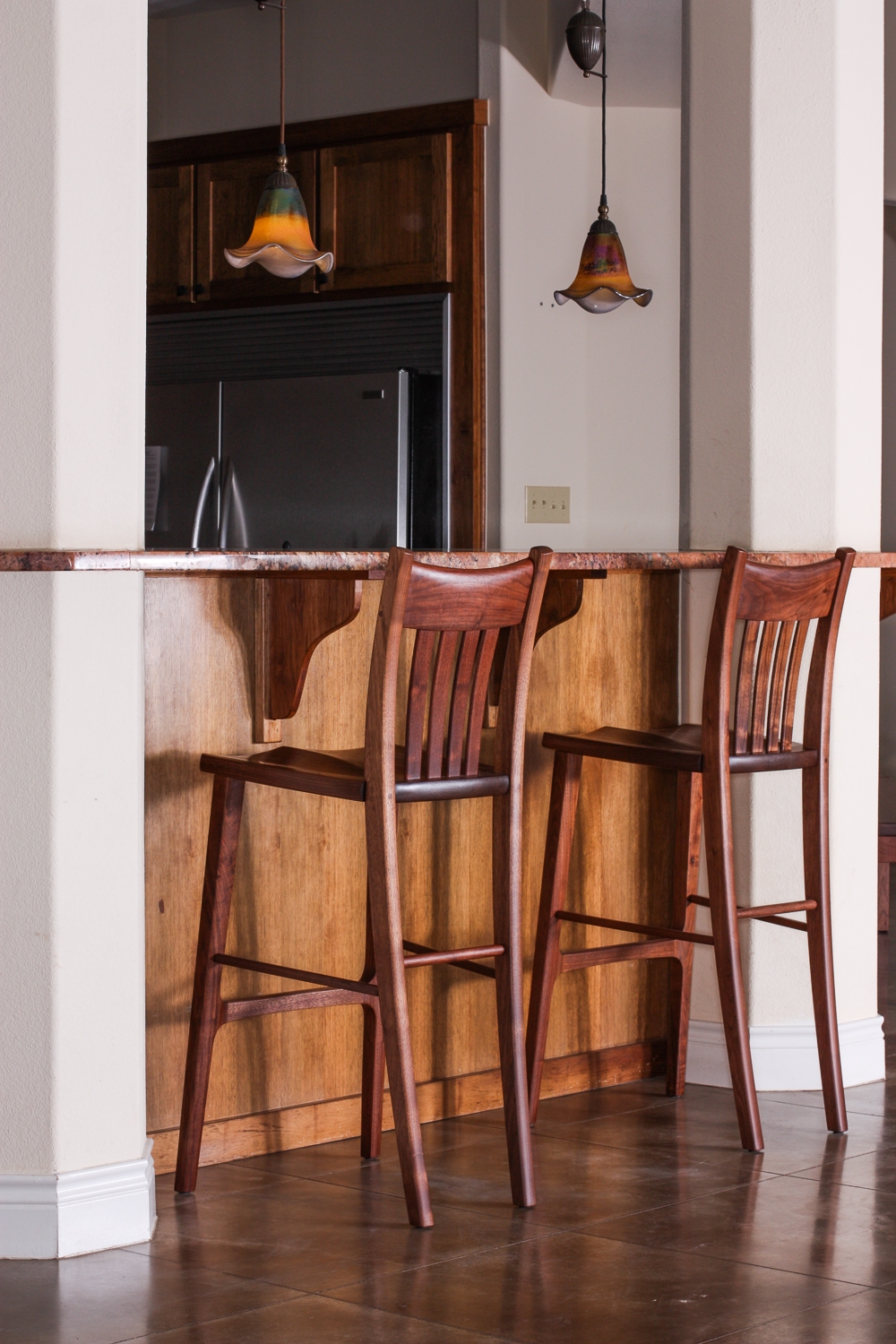 two Heflin barstools at bar