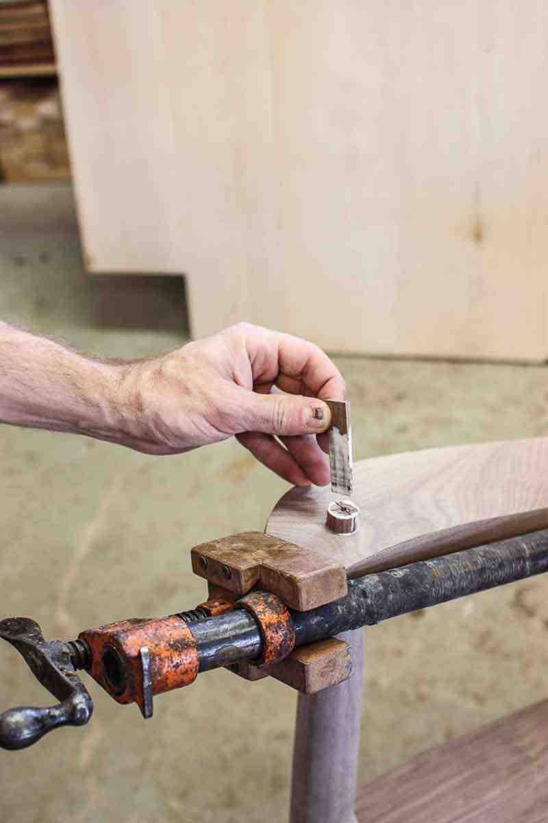 driving a wedge to secure a through tenon 1