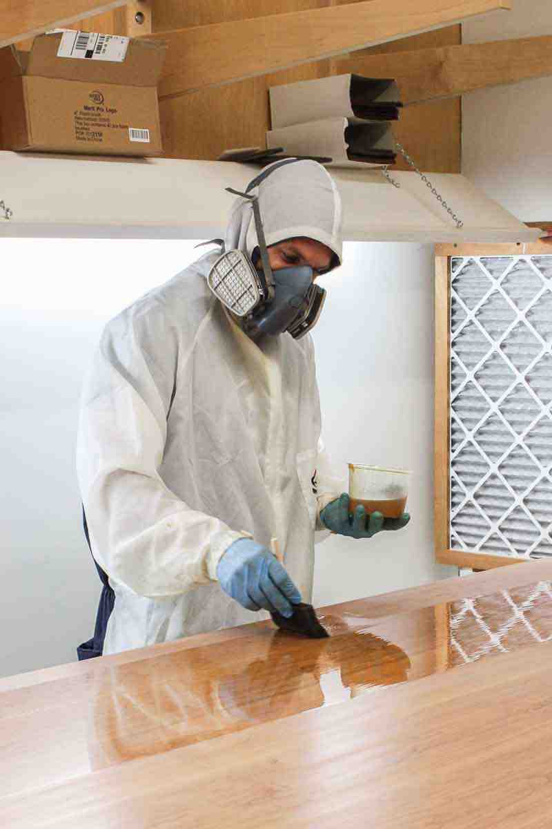 Austin varnishing a dining table top
