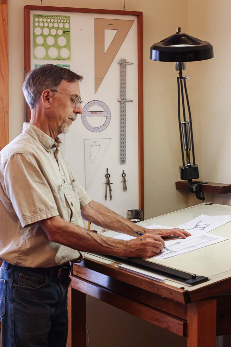 Gary designing a chair at the drawing board
