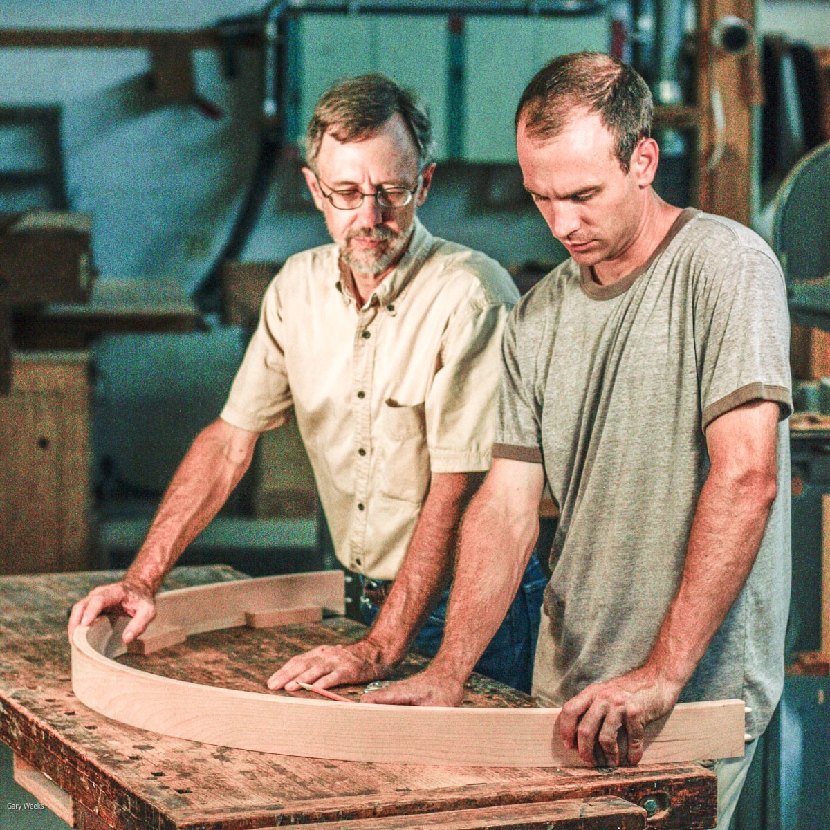 Gary and Austin studying a curved table apron