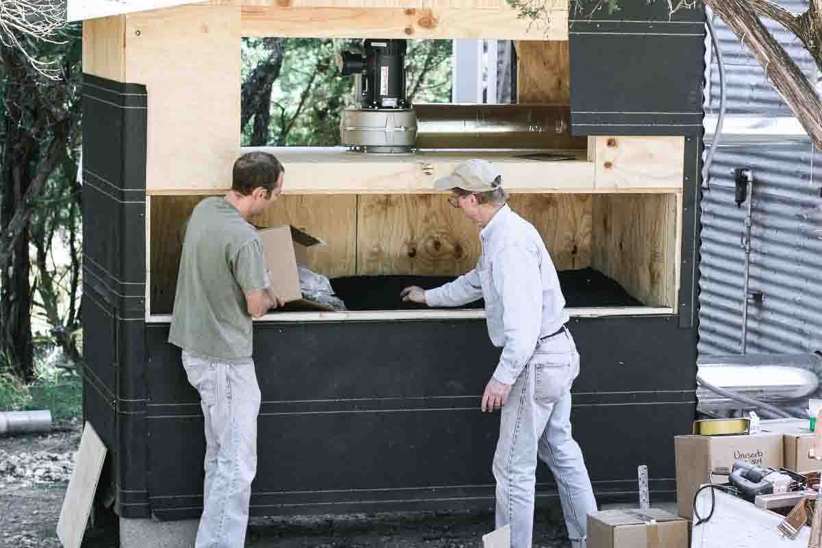 loading VOC scrubber with carbon