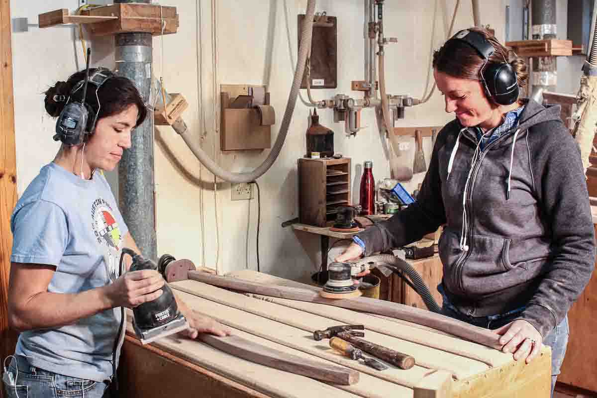 Autumn and Audra sanding back legs