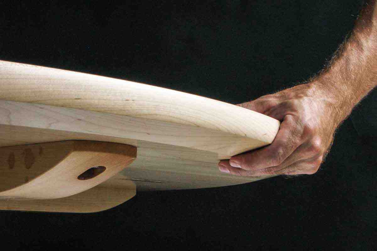 hand on table top edge, 2