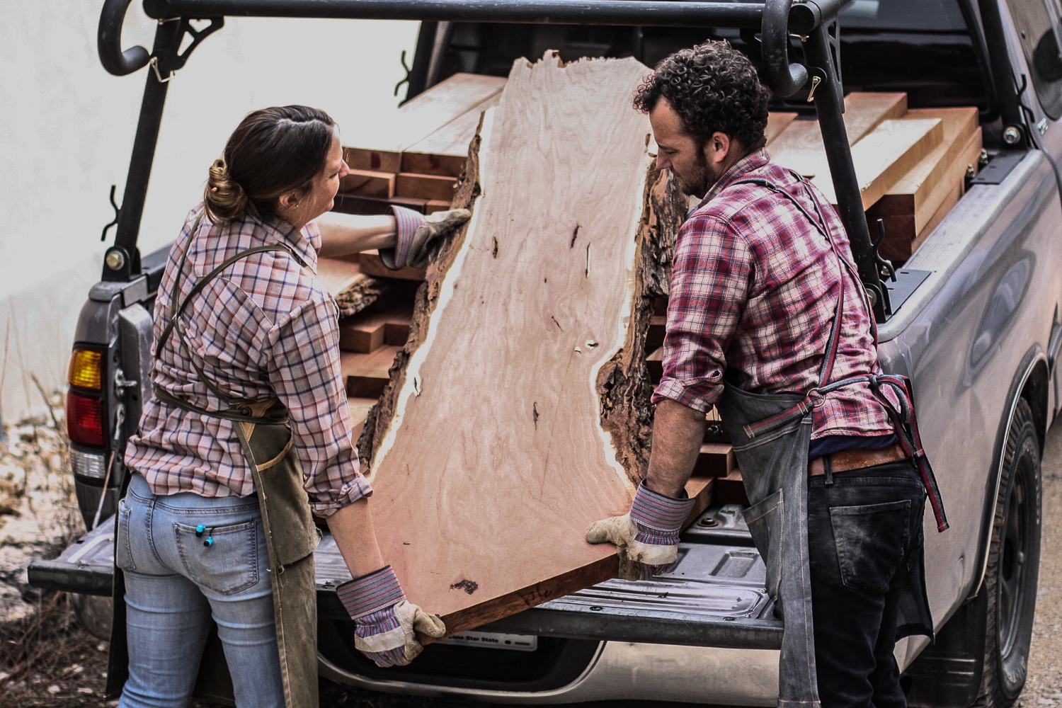 Will and Autumn unloading mesquite odds and ends