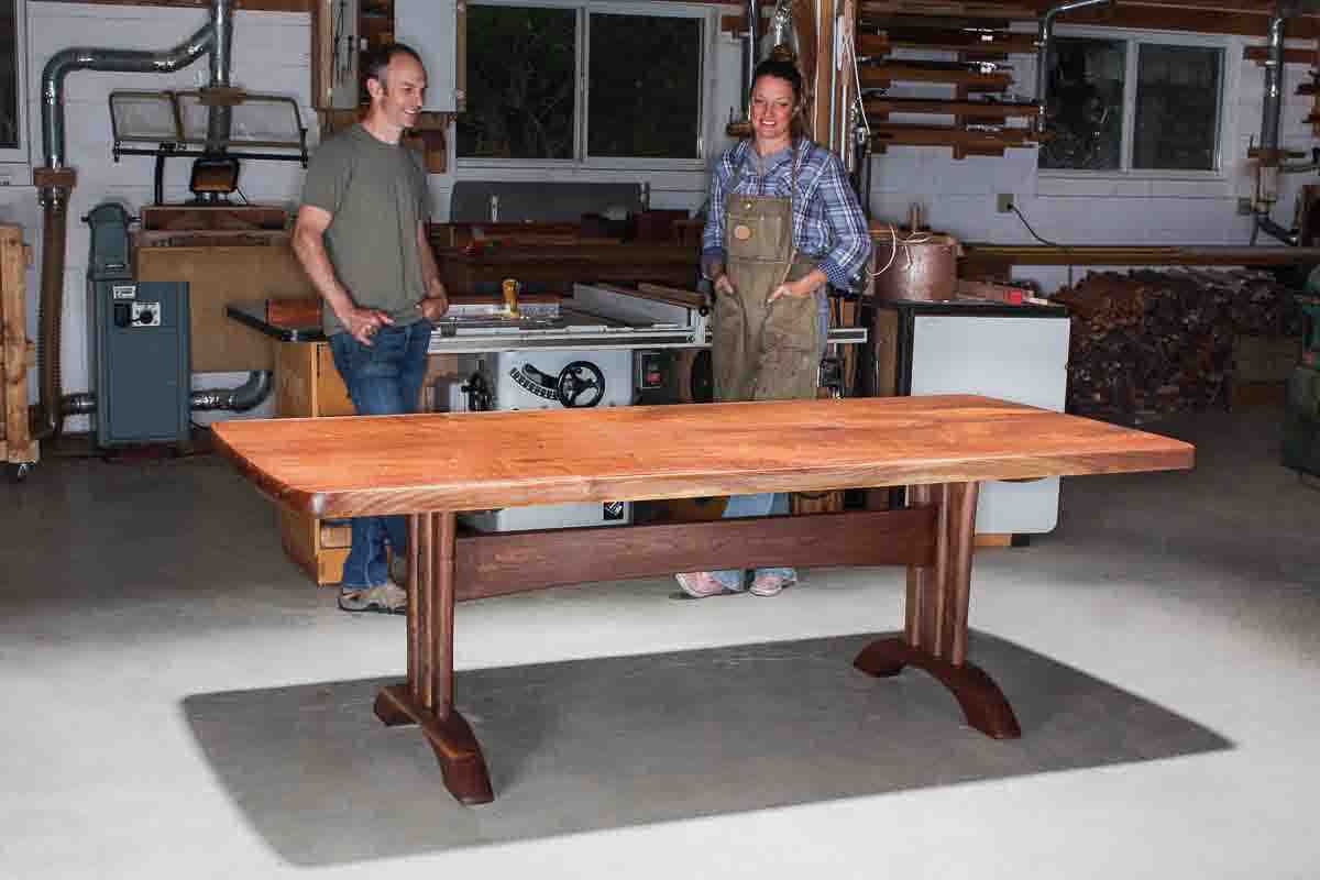 Austin and Autumn with trestle table in shop