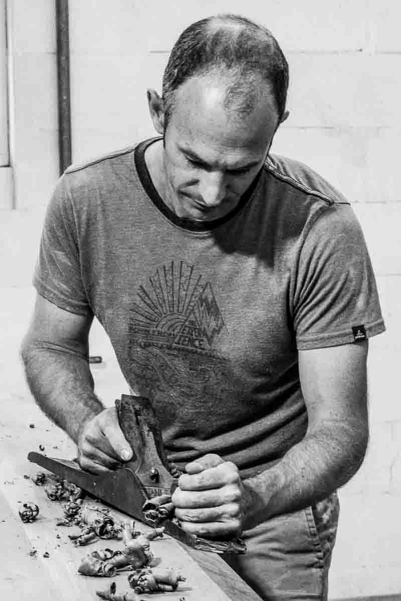 Austin hand planing a table top bevel