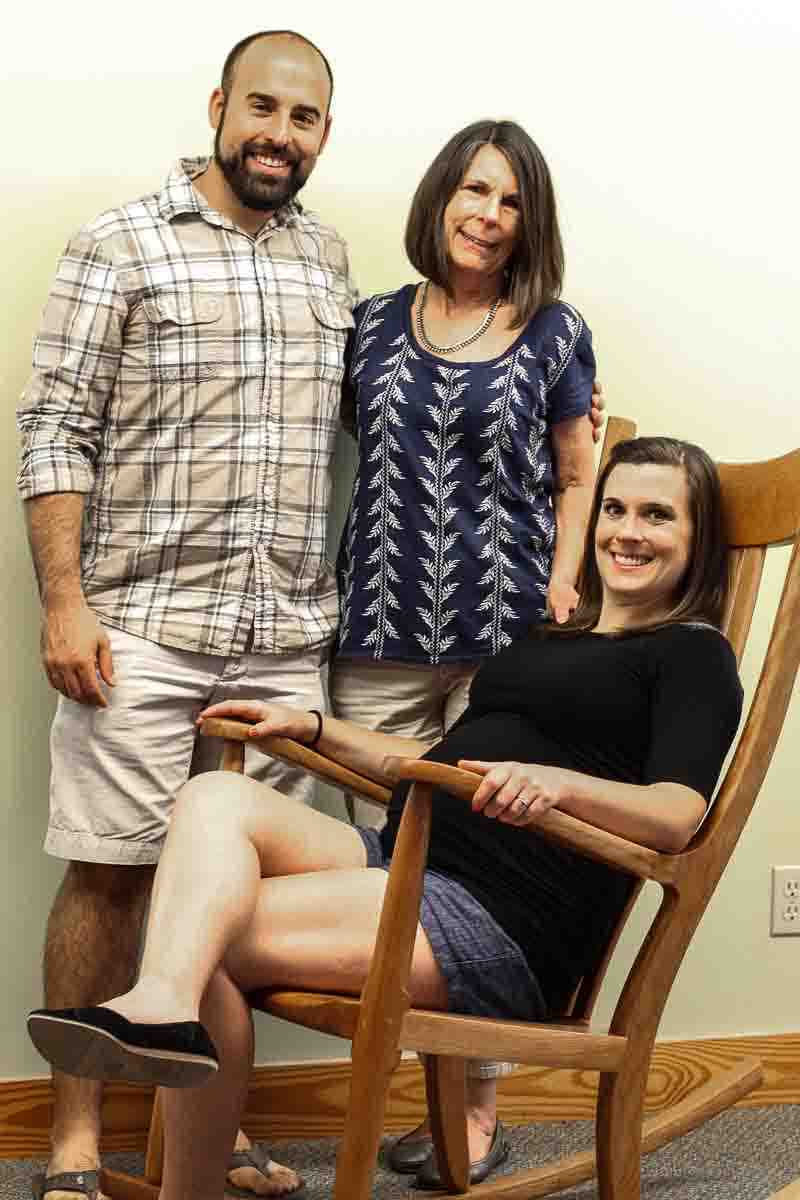 Matt, Kate, and Lynn with rocker for baby coming.