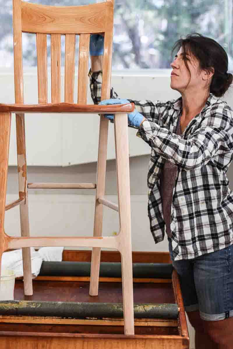 Audra oiling a barstool