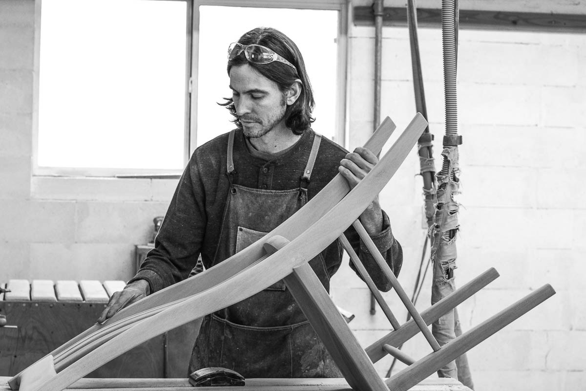 Bonner sanding a dining chair