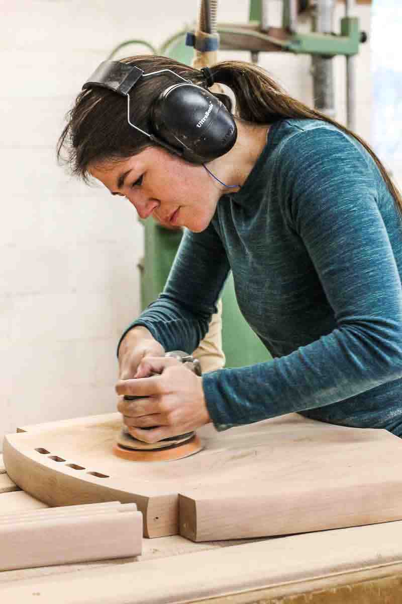Audra sanding a rocking chair seat scoop