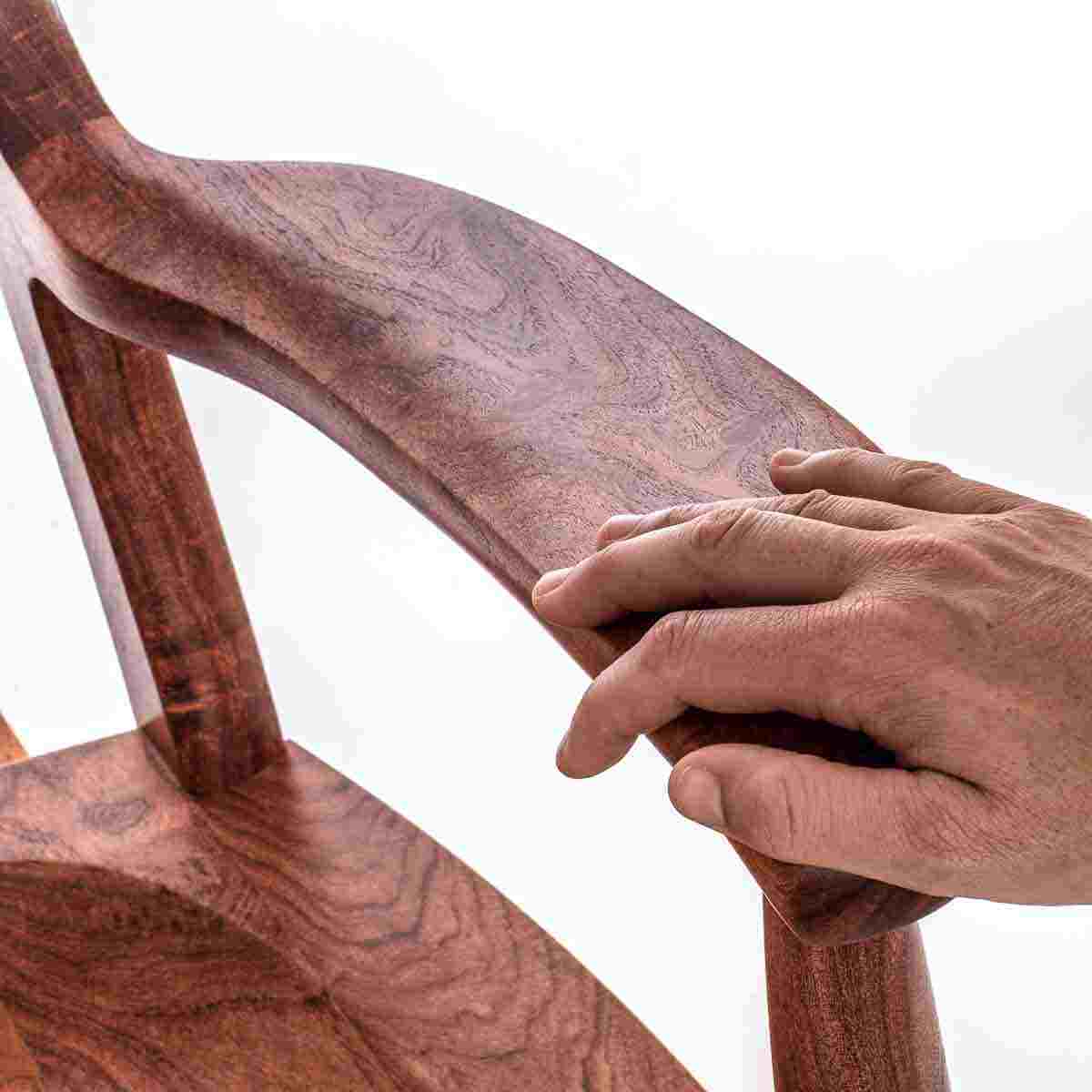 hand on rocking chair arm