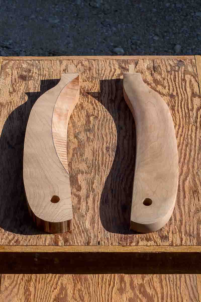 two rocking chair arms, one sawn, one sanded