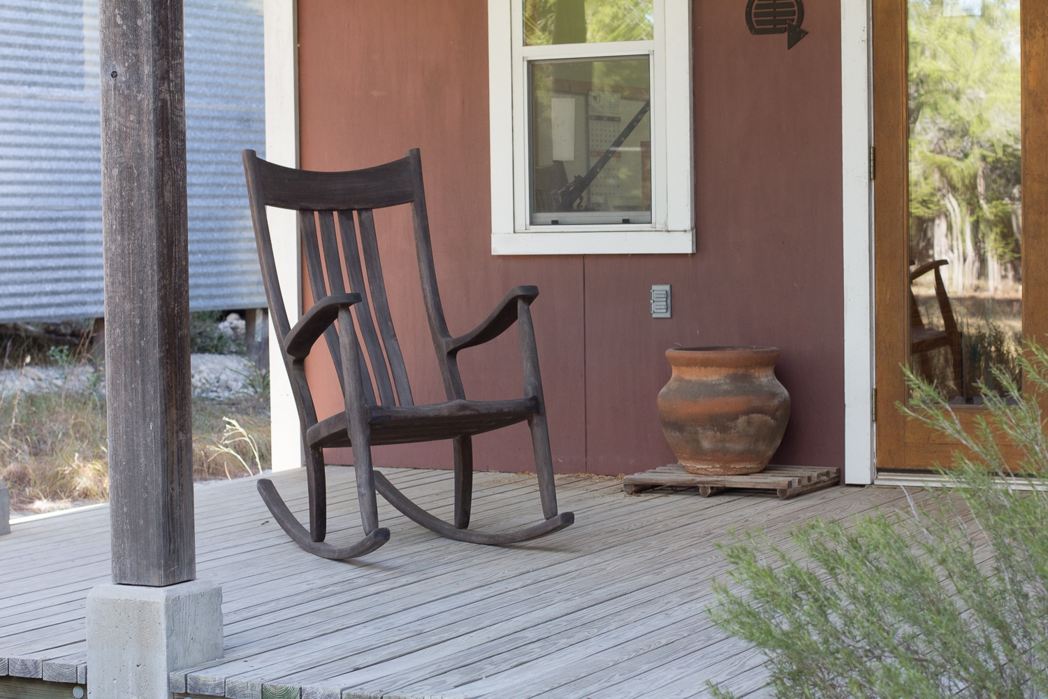 14 year old rocker on the showroom porch