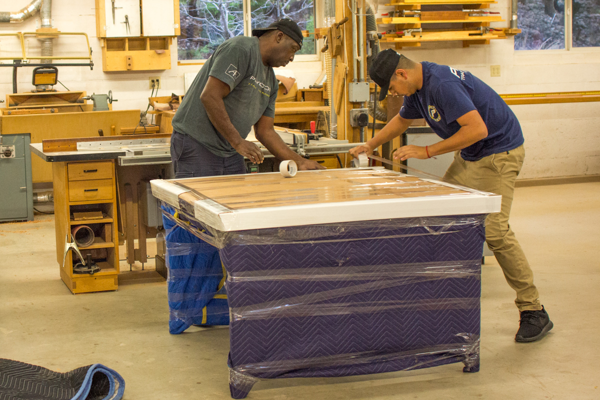 Joseph Blanket-wrapping a Dining Table