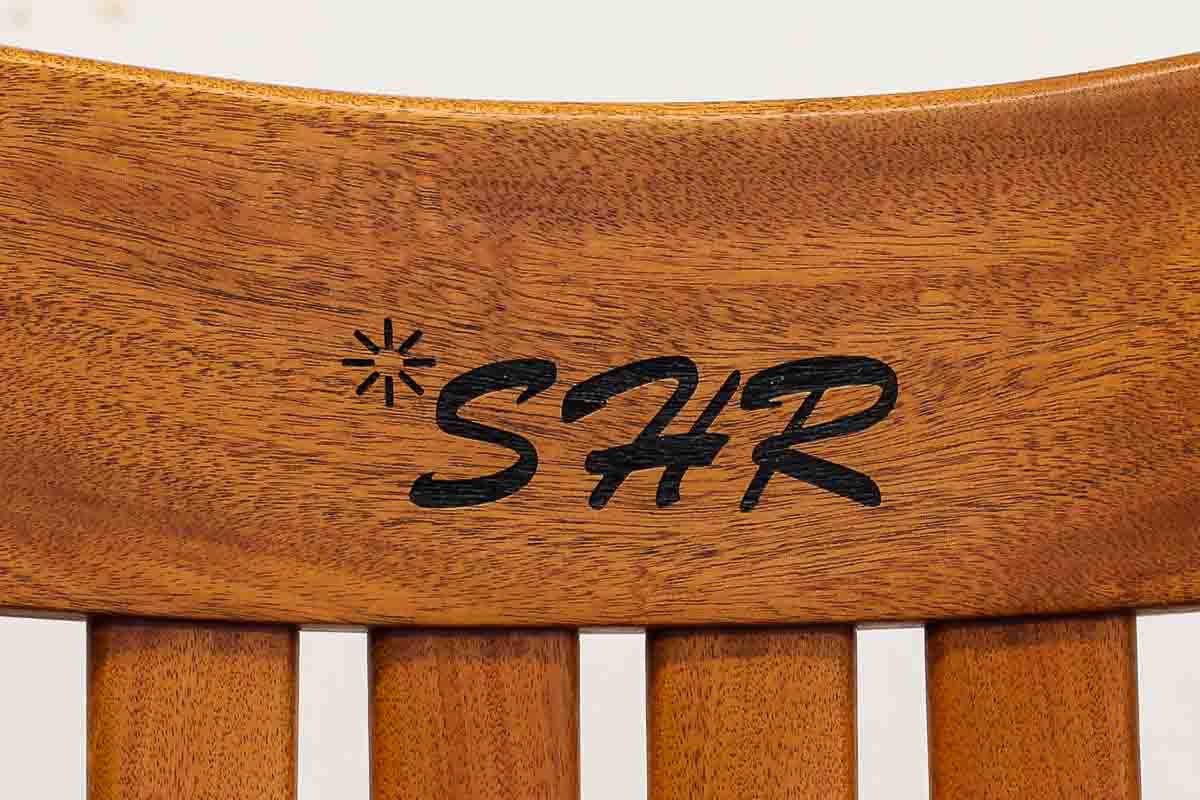 logo and initials engraved in rocking chair