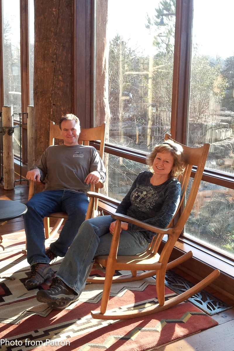 couple in Weeks rocking chairs at resort