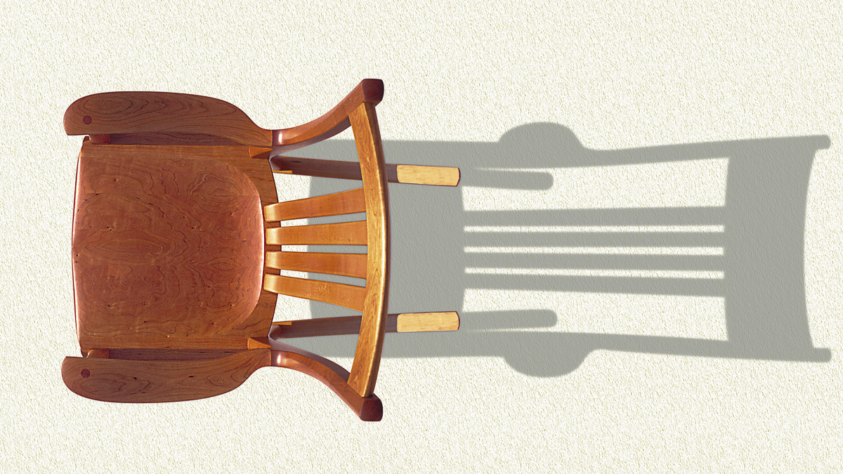 Overhead view of cherry rocking chair taken at sunrise.