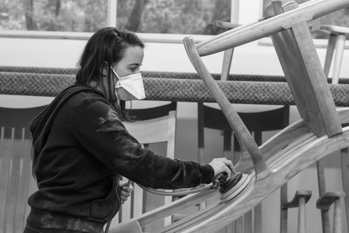 Ashley Sanding a Custom Rocking Chair