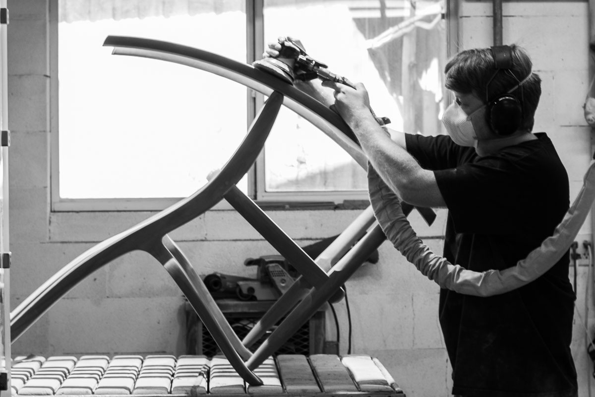 Sean sanding a rocking chair rocker