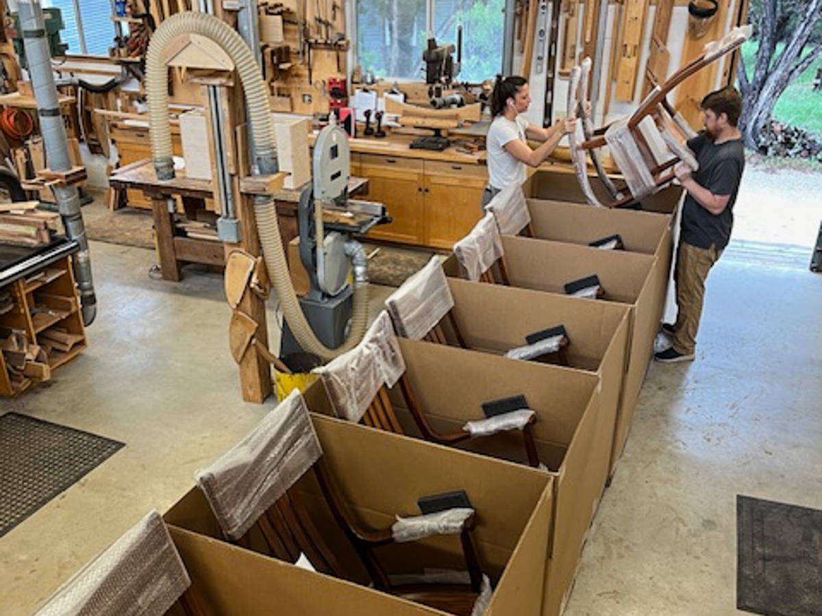 Autumn and Sean crating rockers on a shipping day