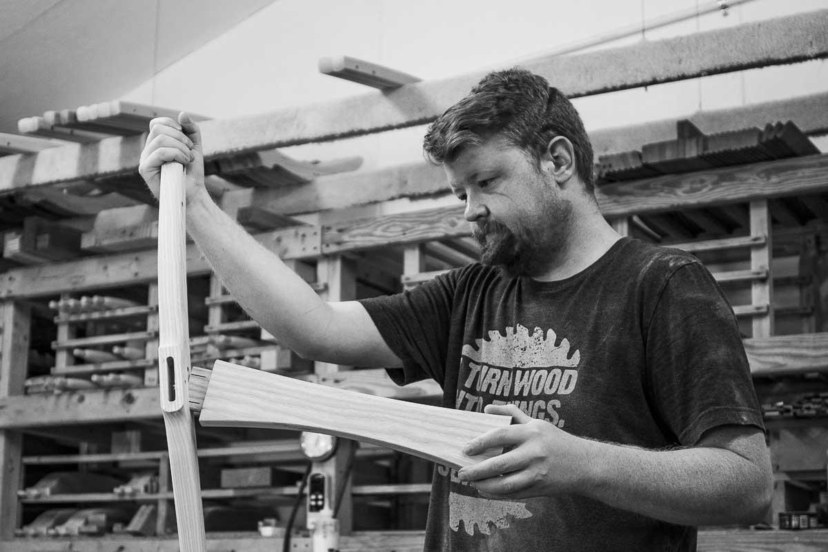 Craftsman assembling dining chair.