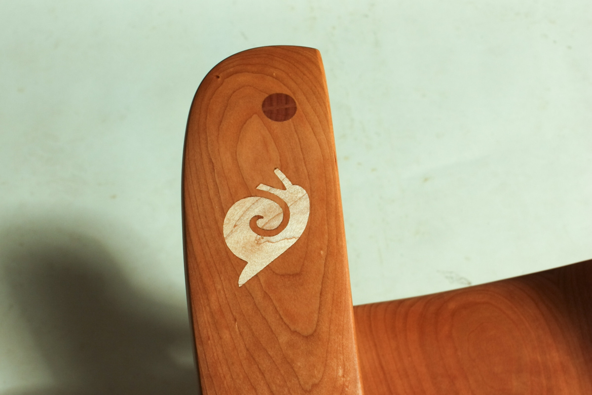 snail inlay on rocking chair arm