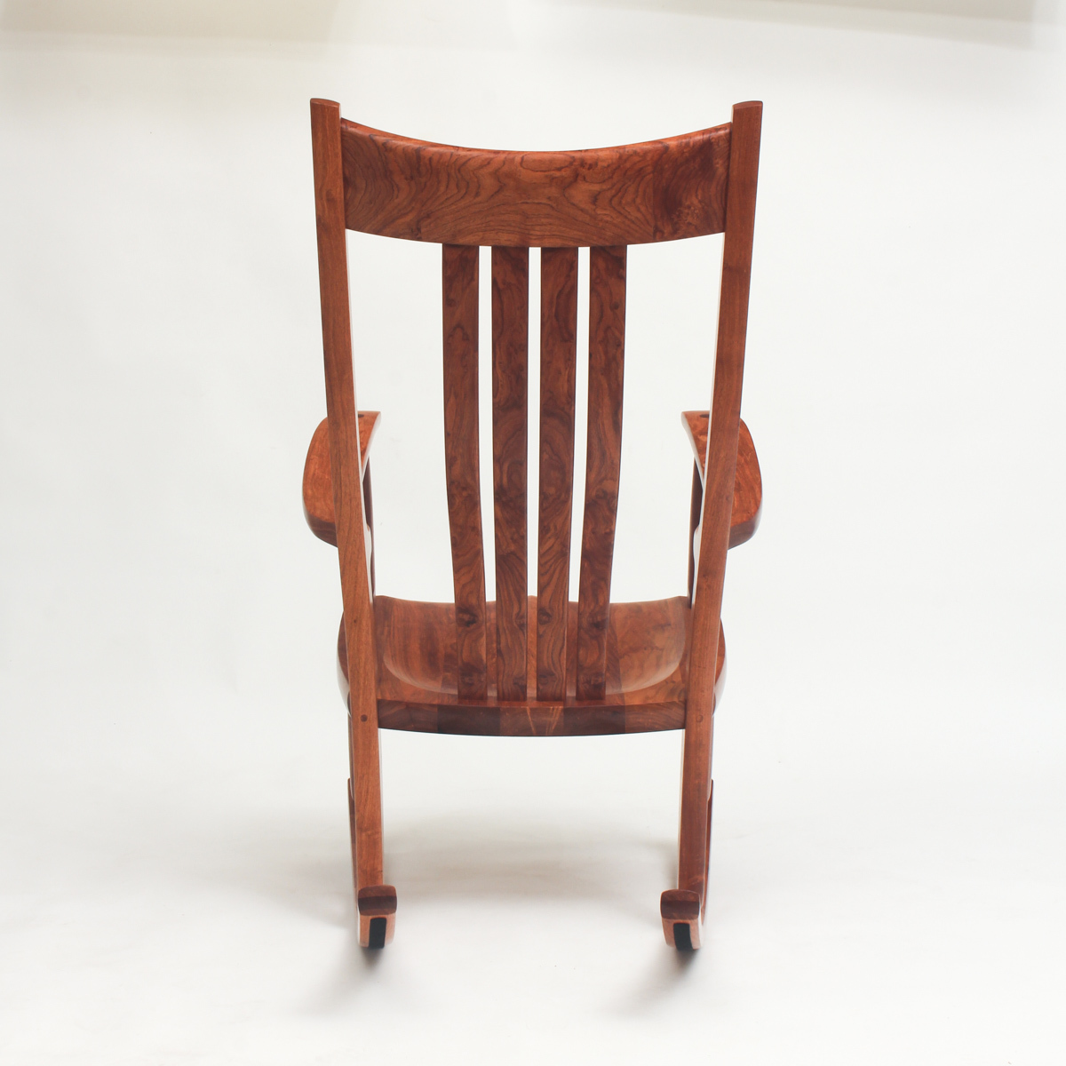 The back view of a mesquite rocker showing the figure of the wood.