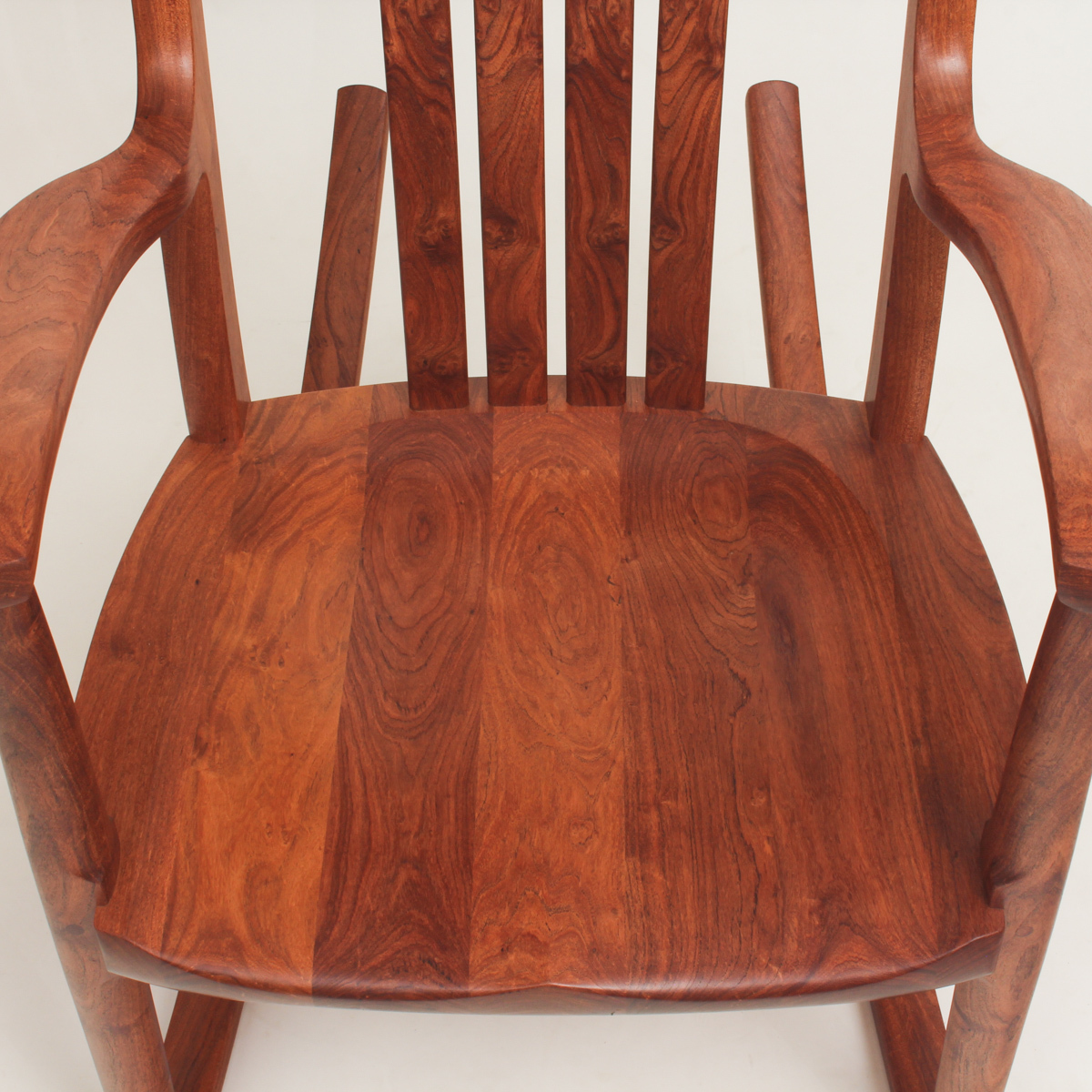 The seat of a mesquite rocking chair from above, showing the figure of the wood.