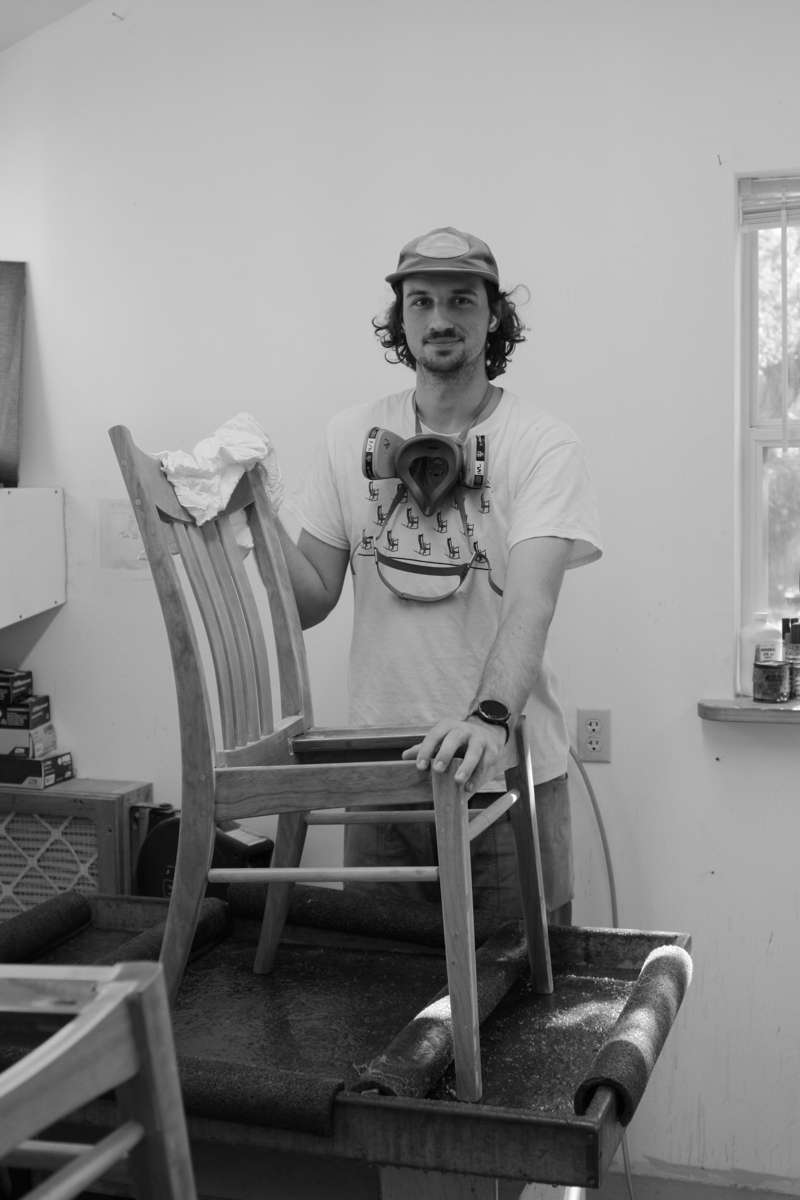 Dylan finishing a dining chair