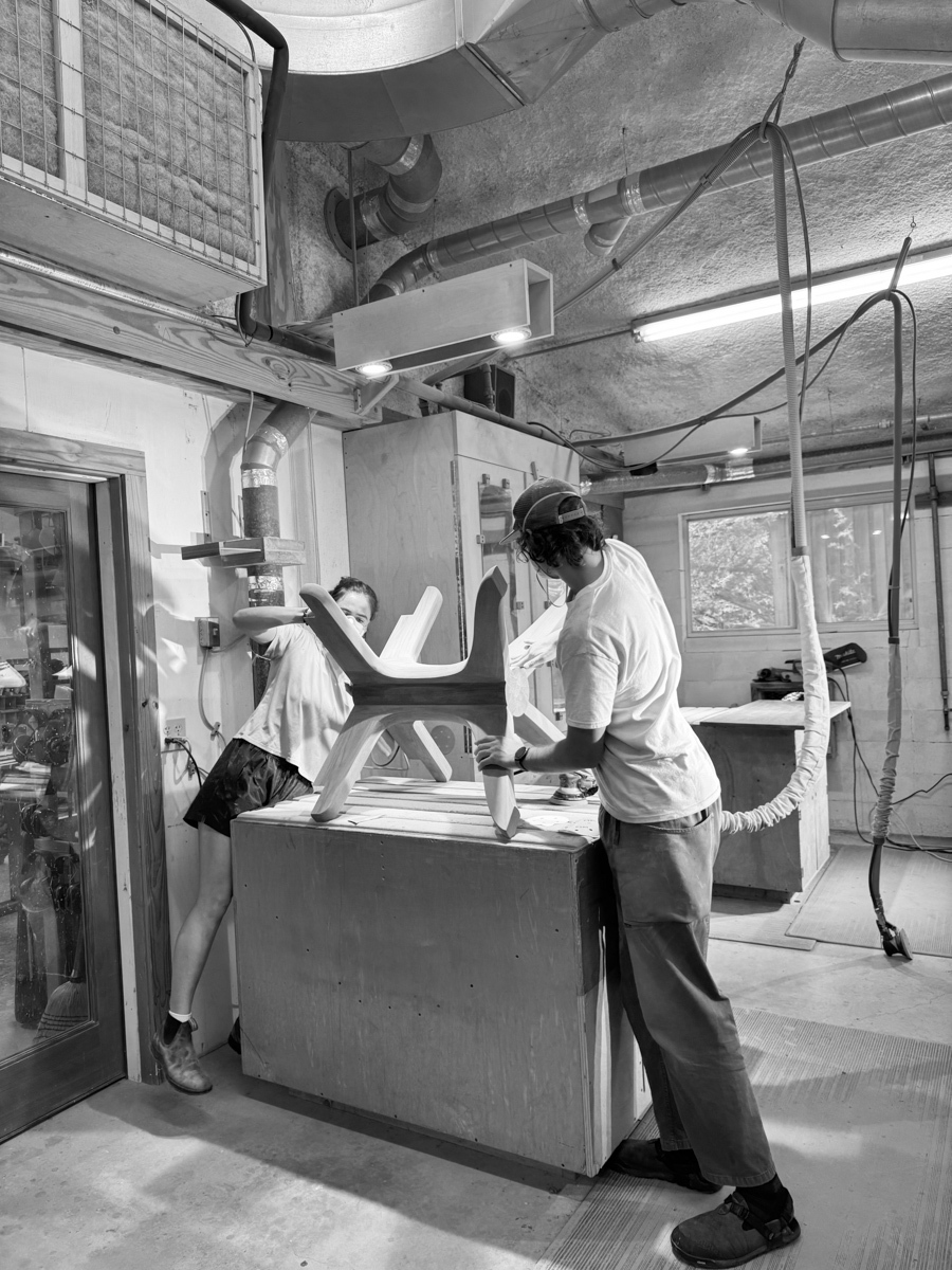 Rachel and Dylan sanding a dining table base