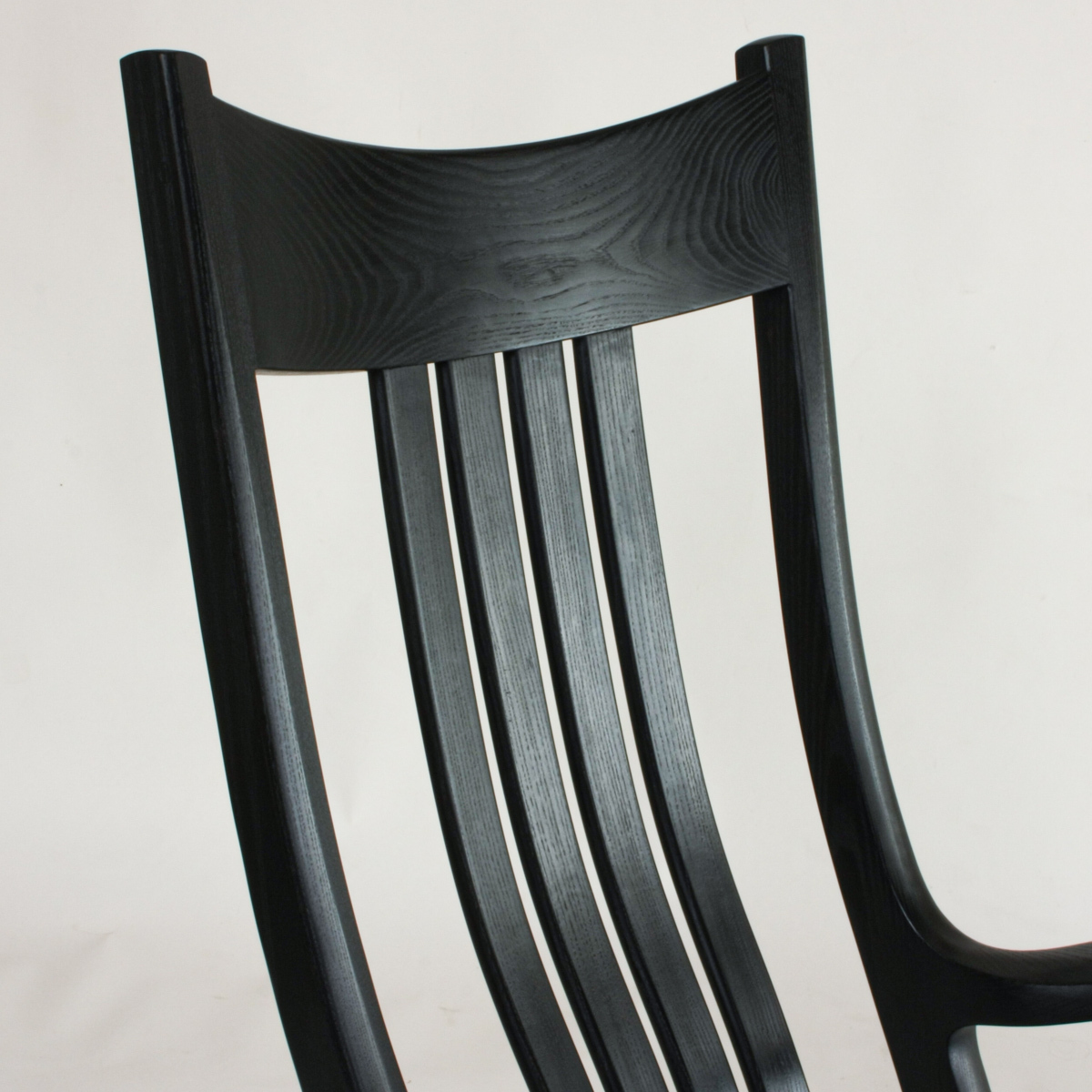 closeup of a Weeks Rocker® crest in ebonized ash.