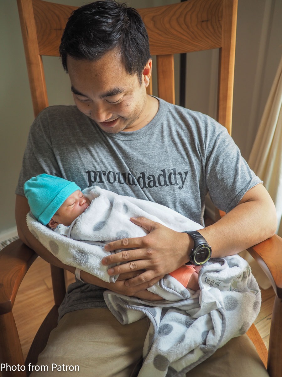 proud daddy in rocking chair