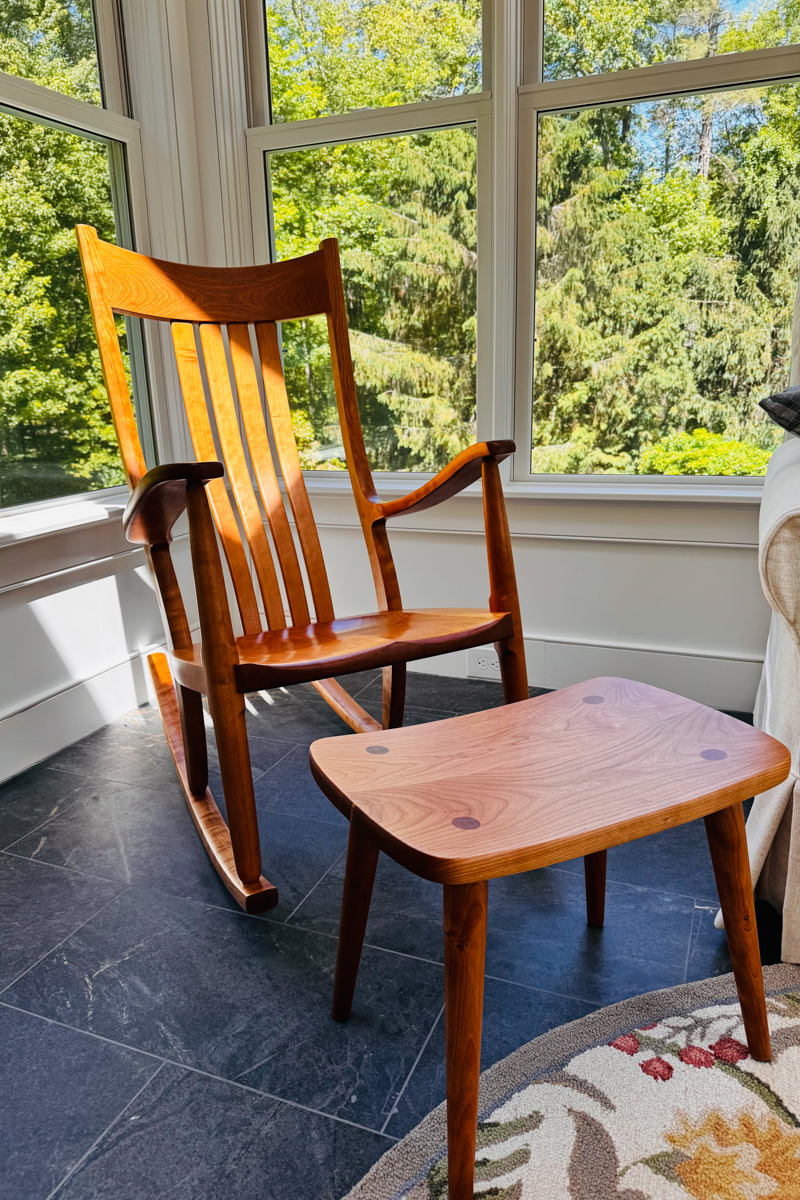patron photo, cherry rocking chair and footstool