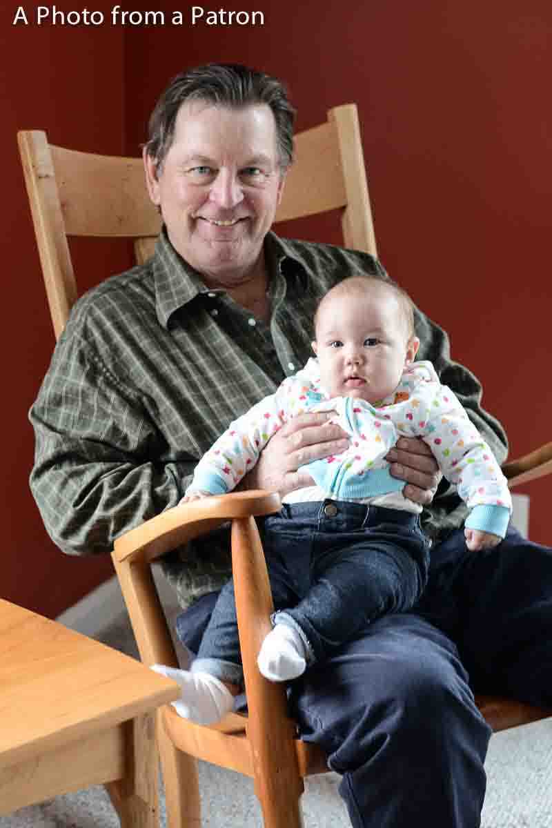 grandfather and child in rocking chair
