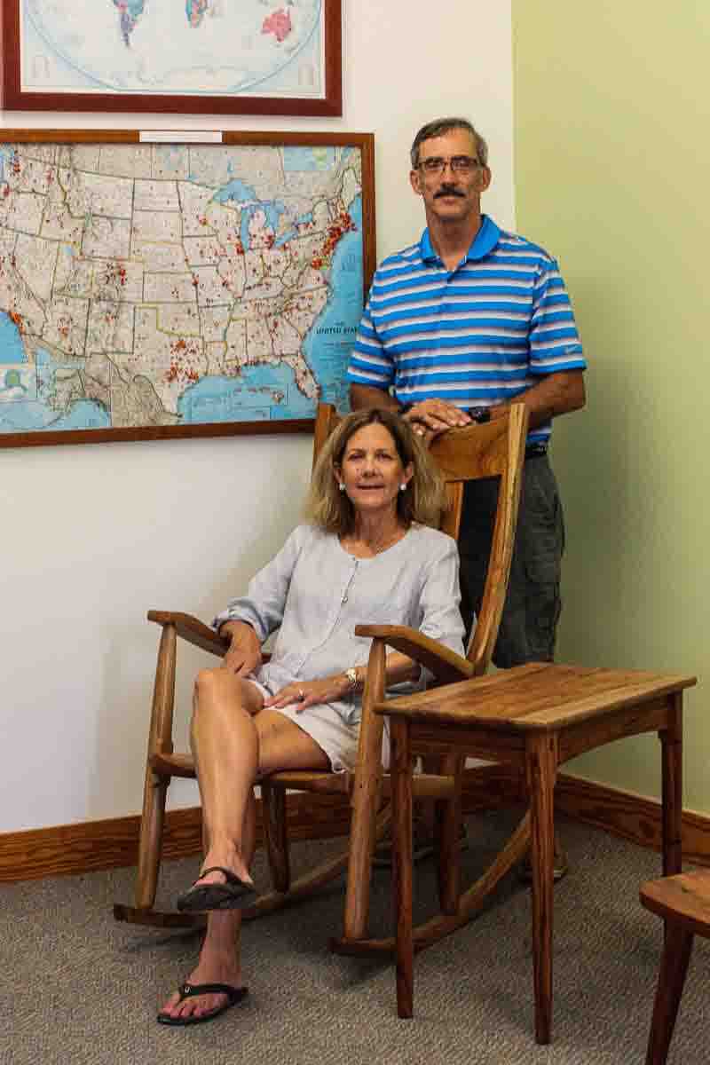Guests trying a rocking chair in showroom