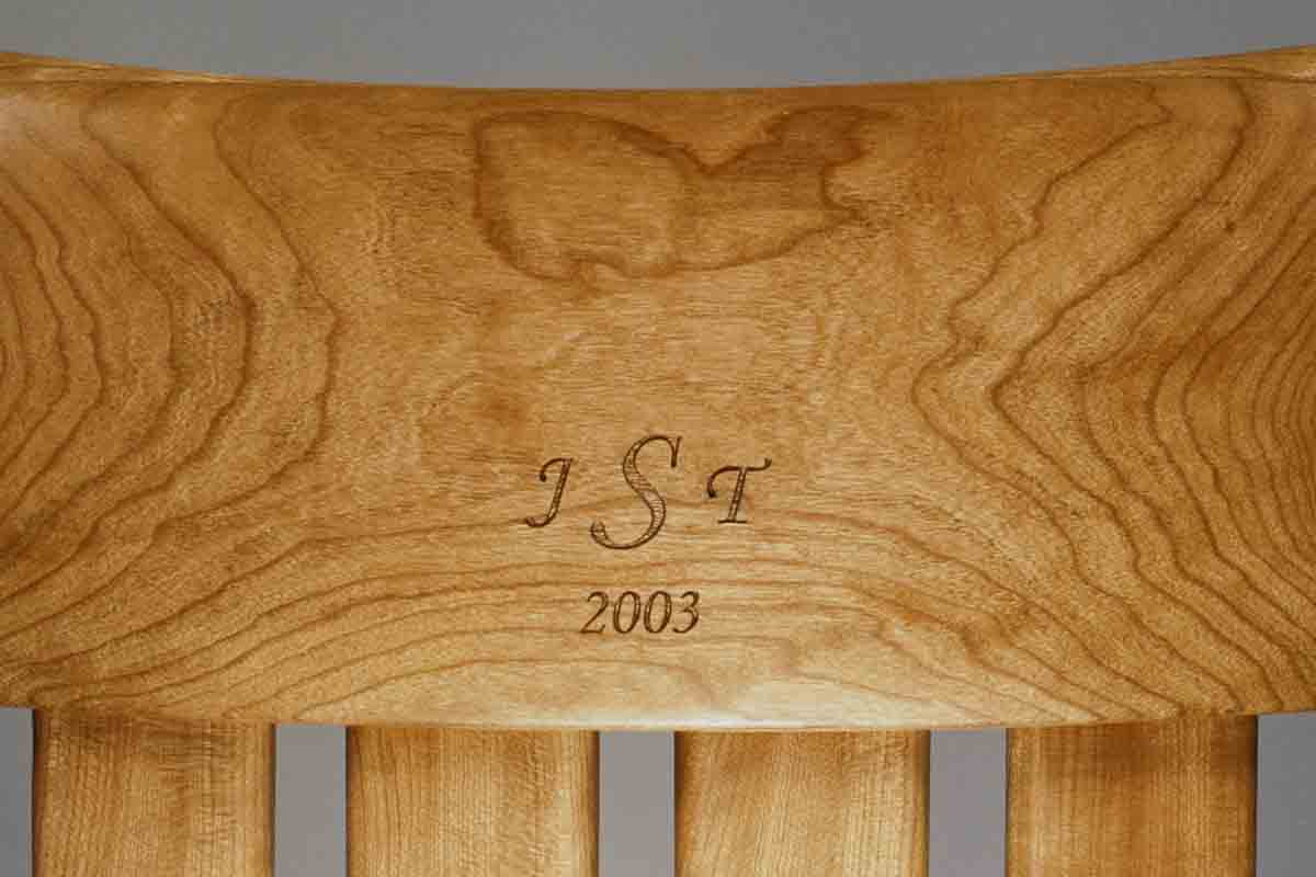 initials and date engraved in rocking chair