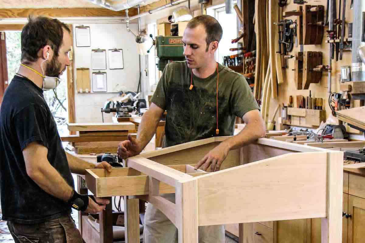 Austin and Aaron fitting standup desk drawers