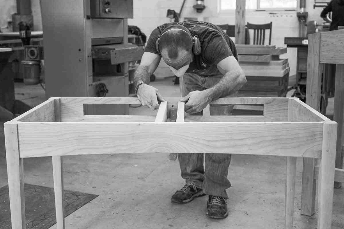 Aaron assembling a writing desk