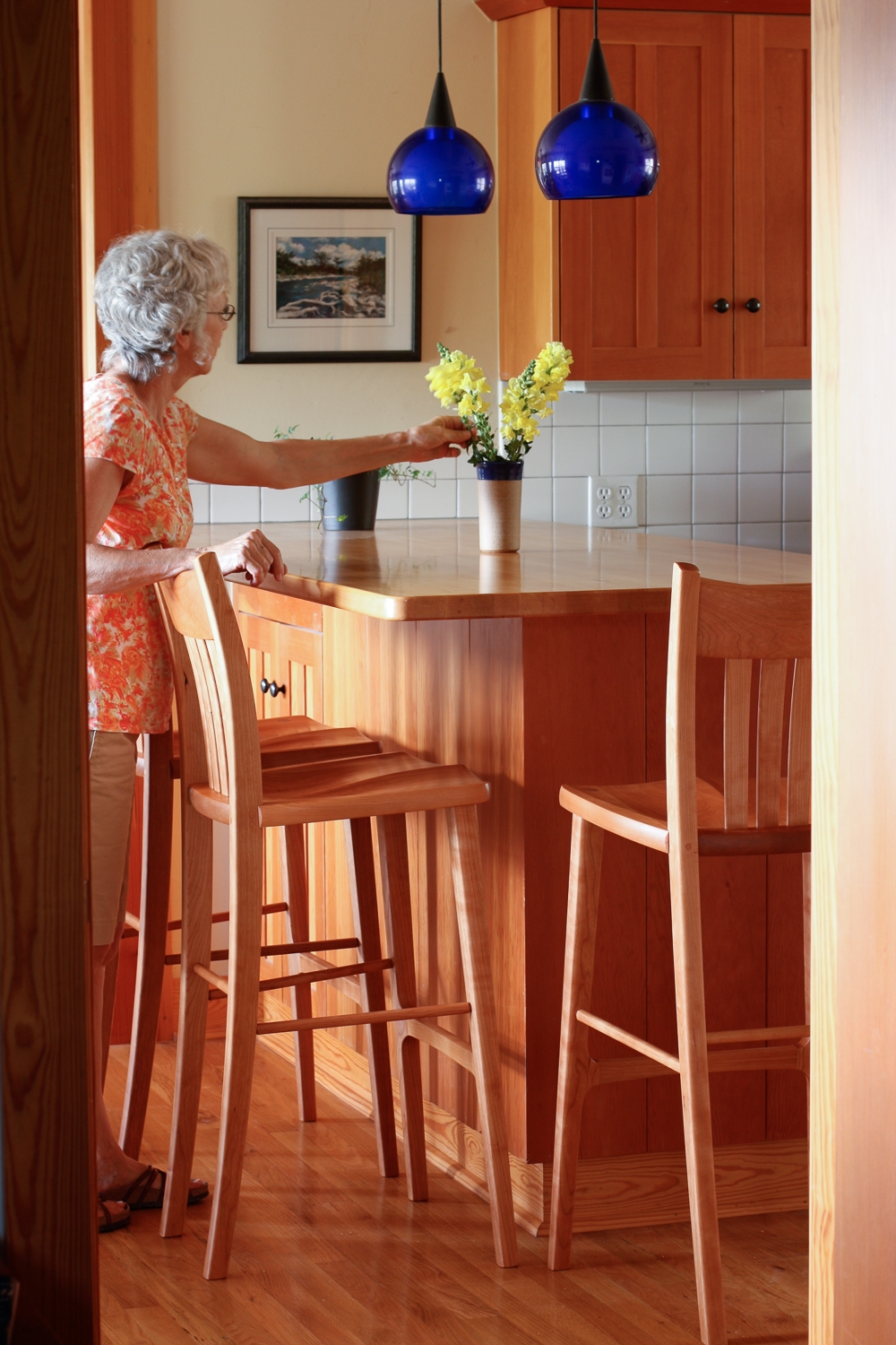 Leslie and barstool in the kitchen