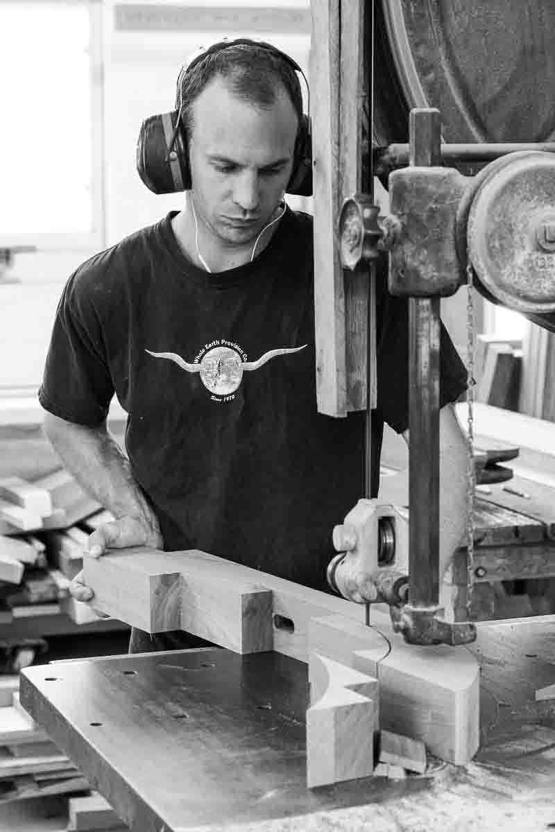Austin bandsawing a trestle table base
