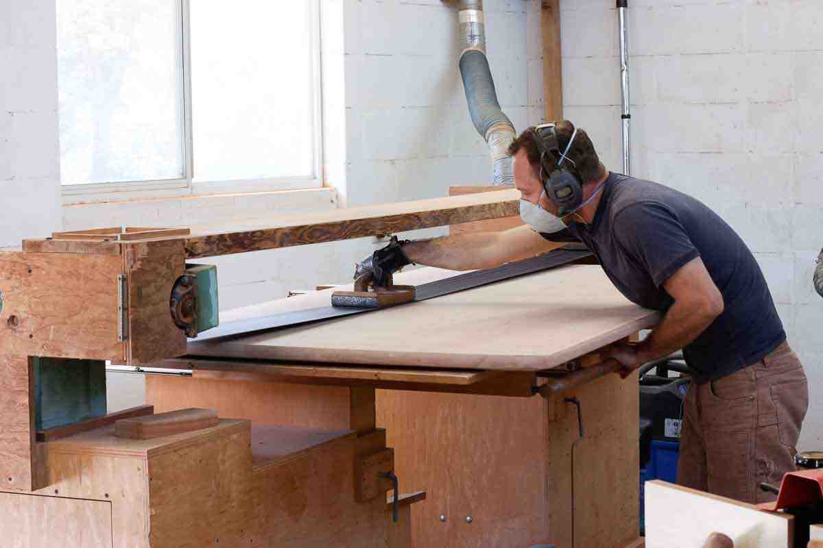Aaron stroke sanding a table top
