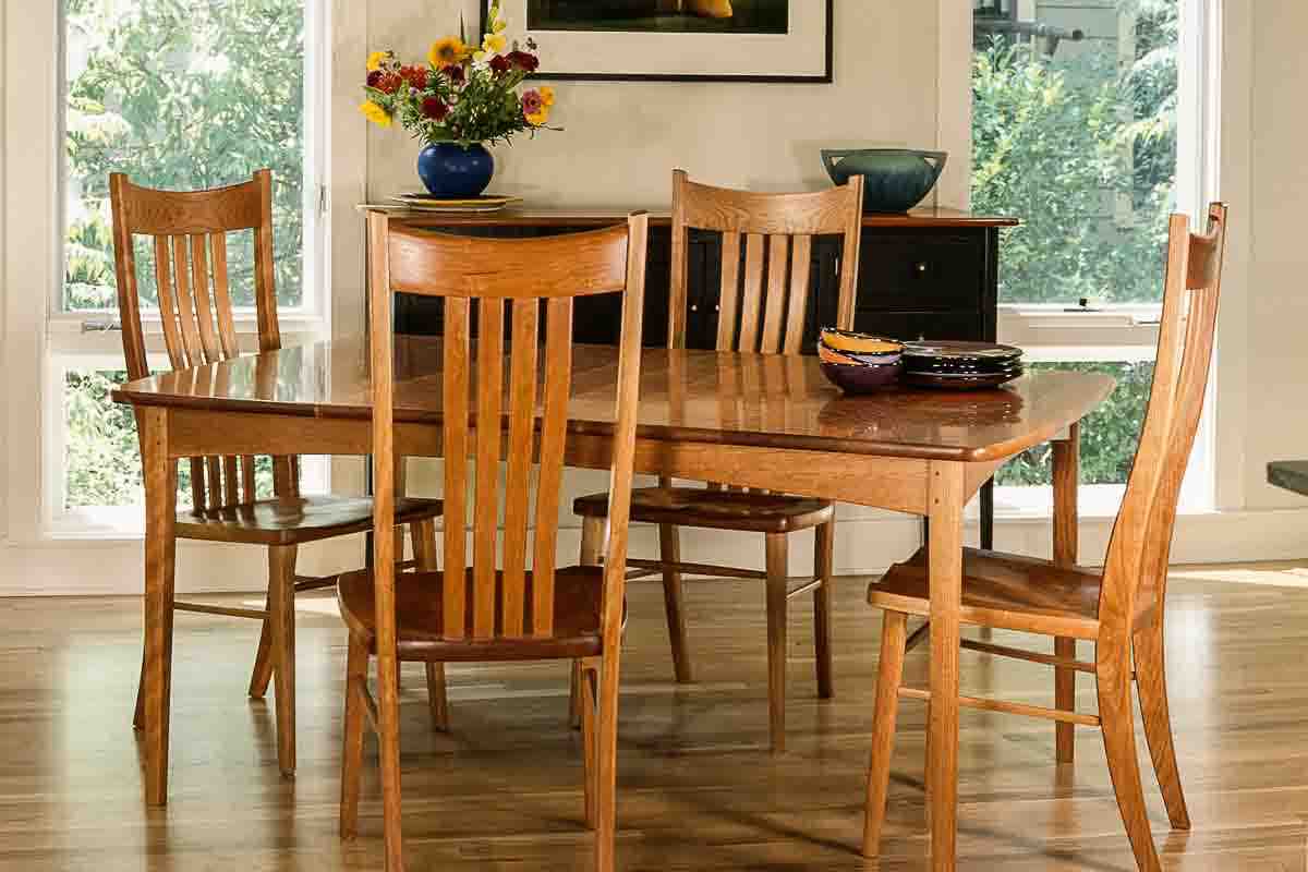 Phillips table with four Wilson chairs in setting