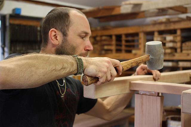 Aaron driving wedges in through tenons
