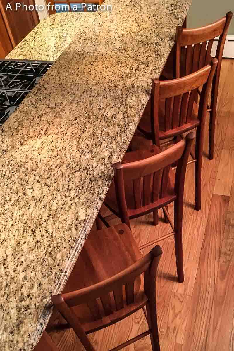 four Heflin barstools at granite bar, overhead view