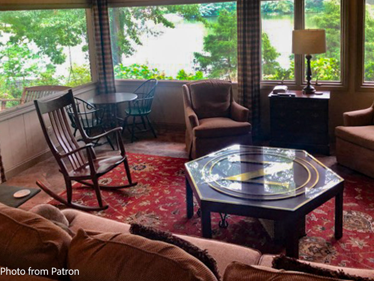 Walnut Rocking Chair in LR overlooking a lake