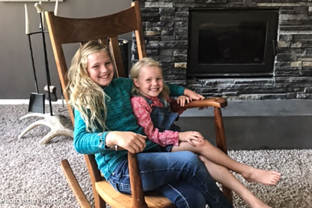 Two sisters in a rocking chair